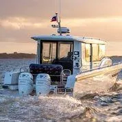 Slide: The Image of Nimbus C11 2025 boat cruising at sunset on open water. - 4