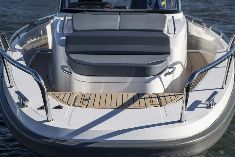 Slide: The Image of Nimbus T11 2025 boat with spacious deck and cushioned seating. - 2
