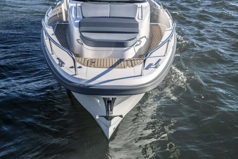 Slide: The Image of 2025 Nimbus T11 boat cruising on water, front view. - 7