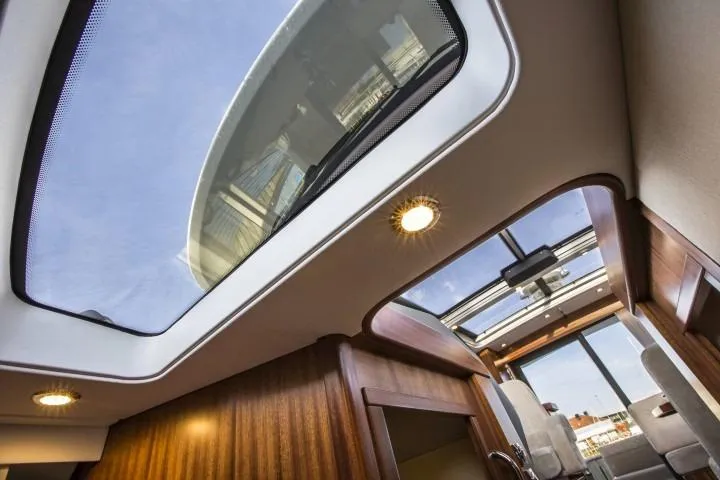Slide: The Image of Interior view of 2025 Nimbus 405 Coupé yacht with panoramic sunroof. - 18