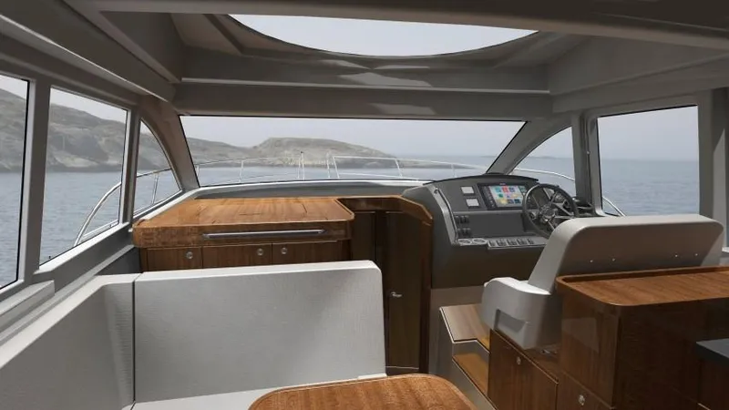 Slide: The Image of Interior of 2025 Nimbus 405 Coupé yacht with wooden finishes and modern dashboard. - 9