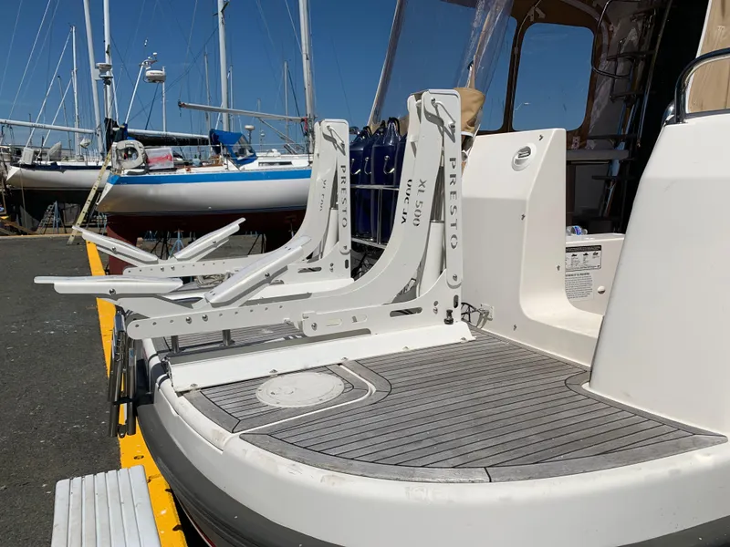 Slide: The Image of Nimbus 405 Flybridge 2025 yacht with Presto XL 500 davit system at marina. - 14