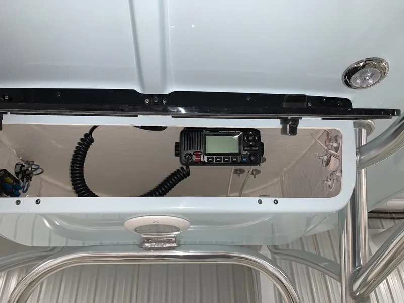 Slide: The Image of 2024 Key West 230 Bay Reef boat console with marine radio. - 10