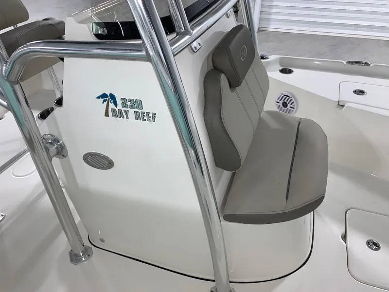 Slide: The Image of 2024 Key West 230 Bay Reef boat interior with seating and console. - 14