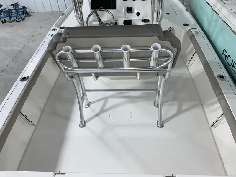 Slide: The Image of 2024 Key West 230 Bay Reef boat interior with rod holders and console. - 4