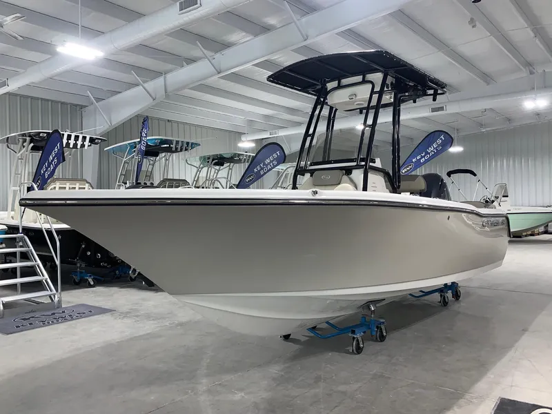 Slide: The Image of 2024 Key West 203 FS boat displayed in a showroom. - 0