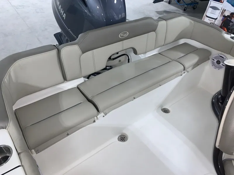 Slide: The Image of 2024 Key West 203 FS boat with cushioned seating and Yamaha outboard motor. - 3