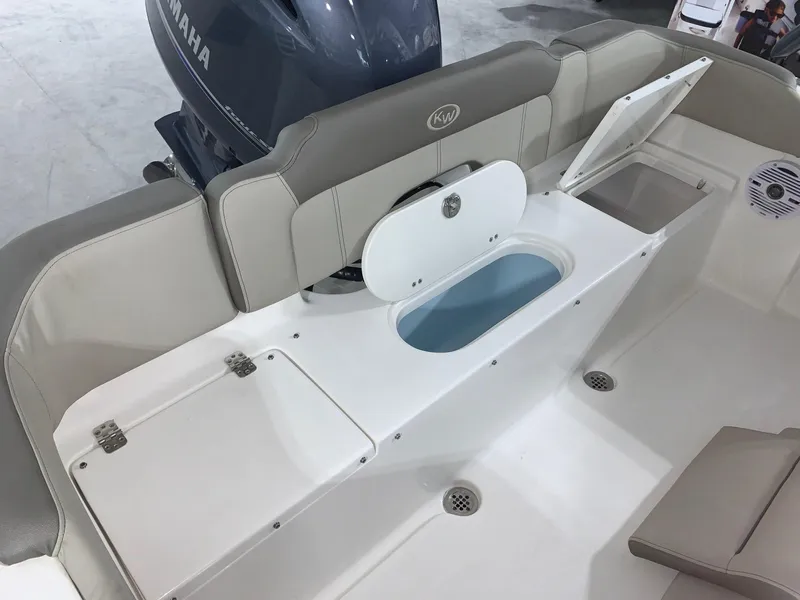 Slide: The Image of 2024 Key West 203 FS boat interior with Yamaha engine and storage compartments. - 4
