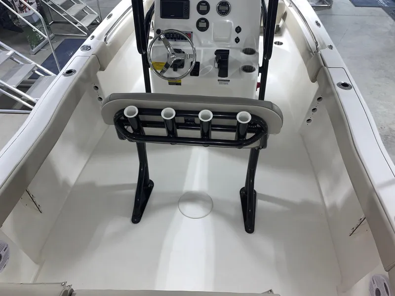 Slide: The Image of 2024 Key West 203 FS boat interior with console and rod holders. - 5