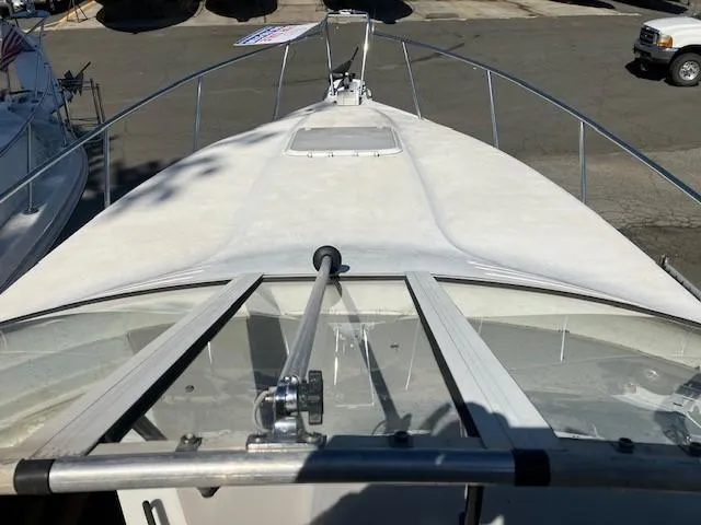 Slide: The Image of 1997 Donzi 27 LXC boat bow view with railings and hatch. - 3