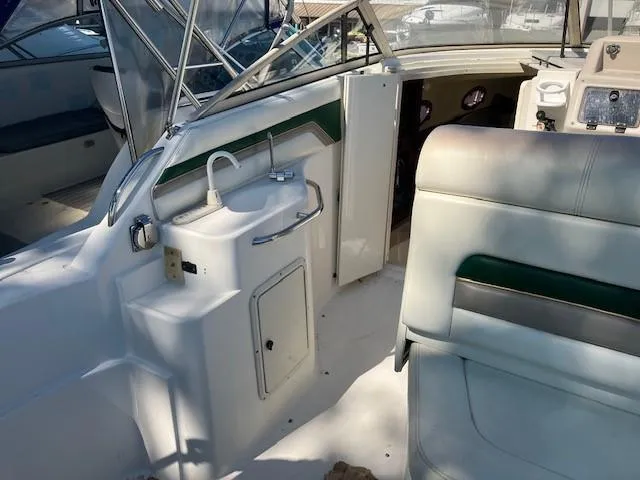 Slide: The Image of Interior of a 1997 Donzi 27 LXC boat with sink and seating area. - 4
