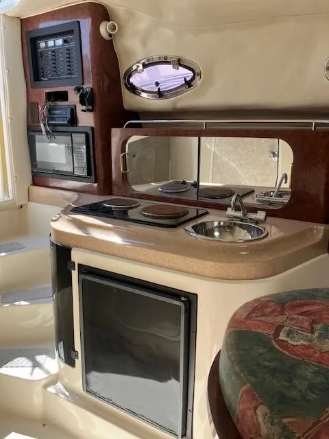 Slide: The Image of Interior of 1997 Donzi 27 LXC boat with kitchenette and appliances. - 9