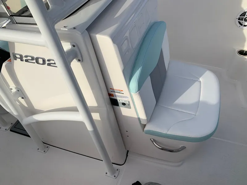Slide: The Image of 2024 Robalo R202 Explorer boat interior seating and console. - 14