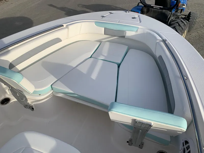 Slide: The Image of 2024 Robalo R202 Explorer boat with cushioned seating area. - 15