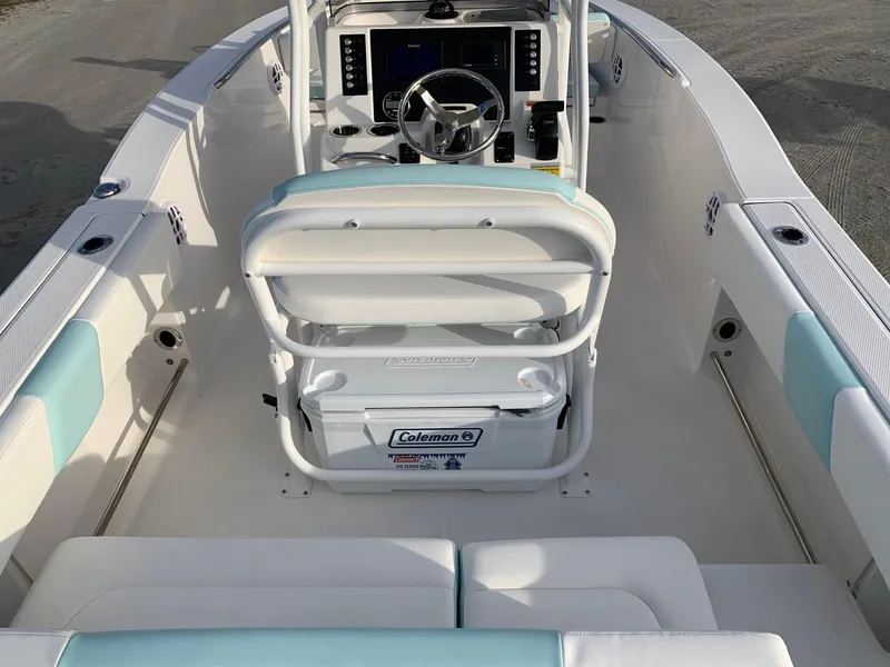 Slide: The Image of 2024 Robalo R202 Explorer boat interior with helm and seating. - 16
