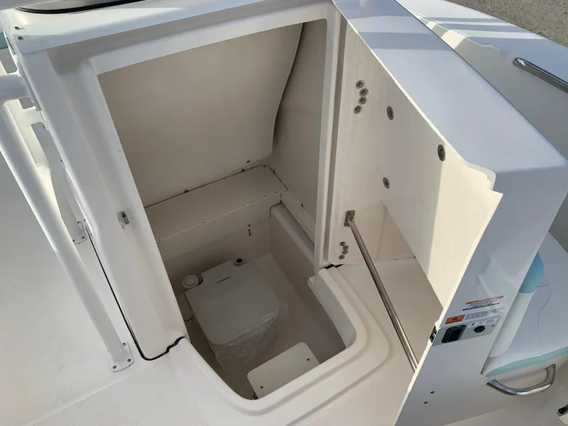Slide: The Image of 2024 Robalo R202 Explorer boat interior storage compartment. - 13