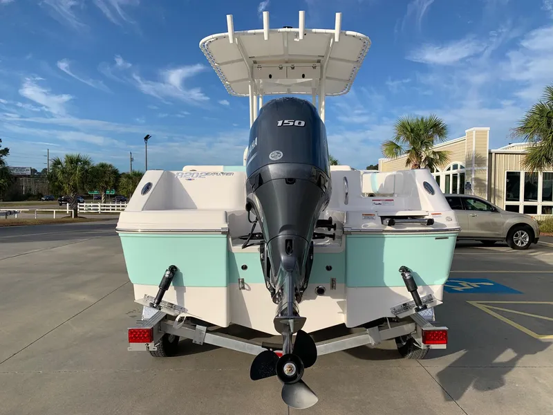 Slide: The Image of 2024 Robalo R202 Explorer boat with 150 HP engine, rear view. - 3