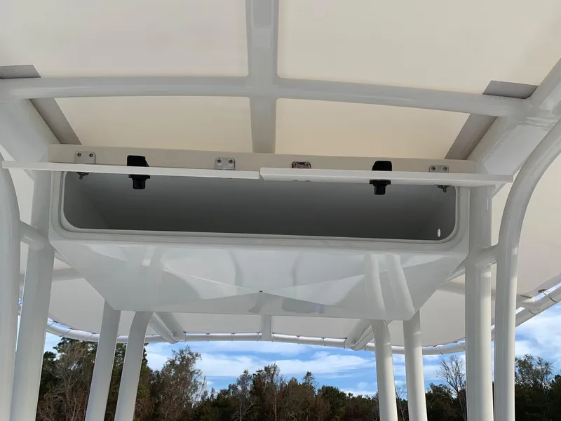 Slide: The Image of 2024 Robalo R202 Explorer boat T-top with storage compartment. - 7