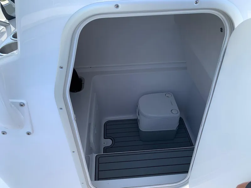 Slide: The Image of 2024 Cape Horn 31T boat interior compartment with portable toilet. - 11