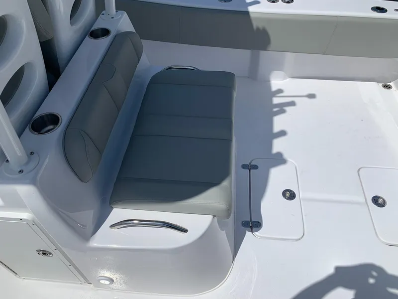 Slide: The Image of 2024 Cape Horn 31T boat interior with gray seating and cup holders. - 14