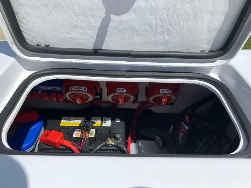 Slide: The Image of 2024 Cape Horn 31T boat battery compartment with labeled switches. - 15