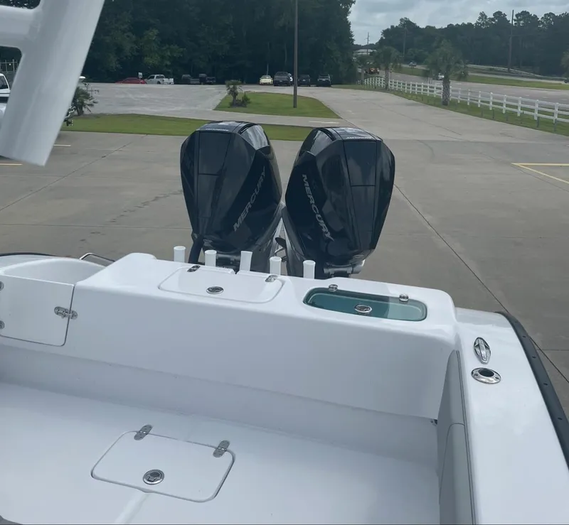 Slide: The Image of 2024 Cape Horn 31T boat with twin outboard engines on a trailer. - 17