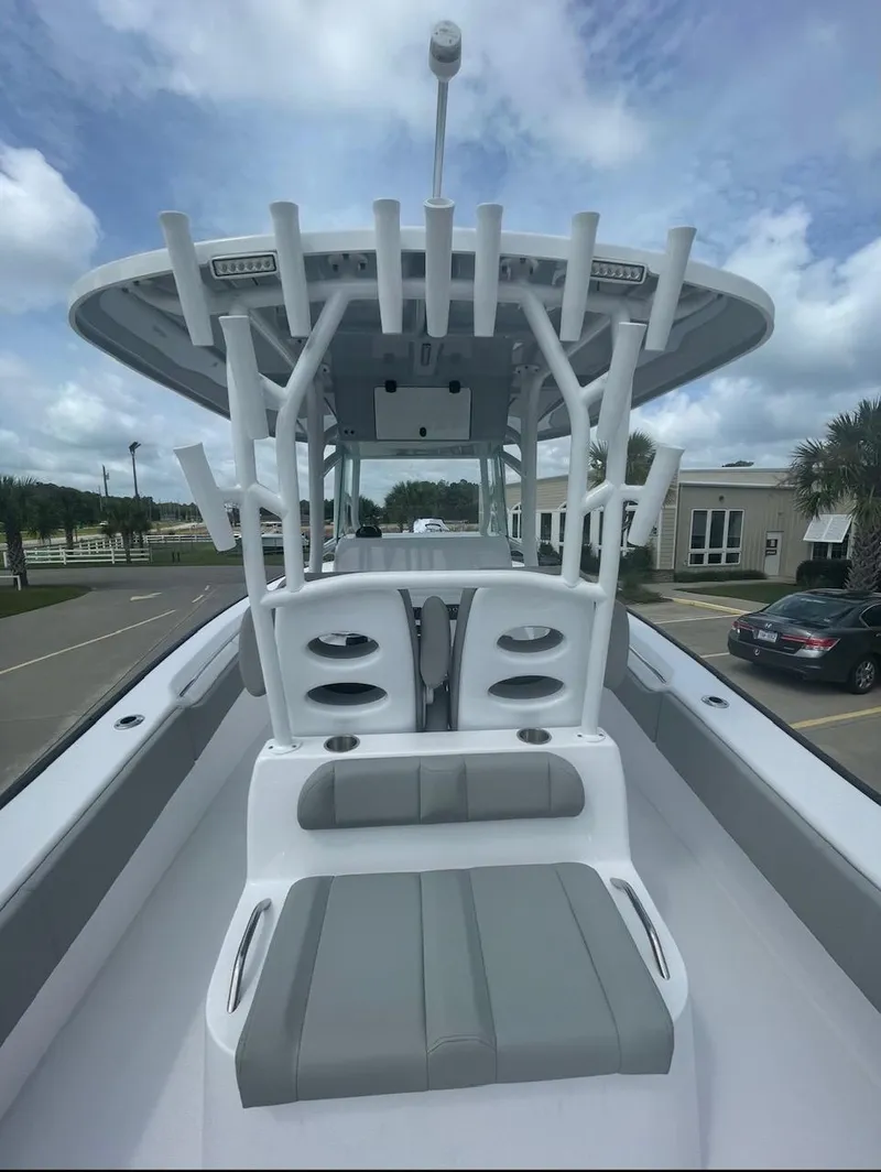Slide: The Image of 2024 Cape Horn 31T center console boat with seating and rod holders. - 3