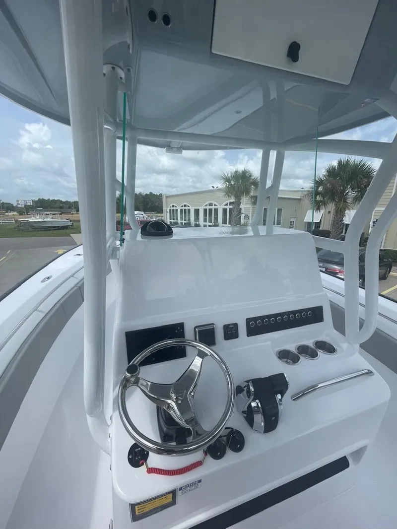 Slide: The Image of 2024 Cape Horn 31T boat console with steering wheel and controls. - 7