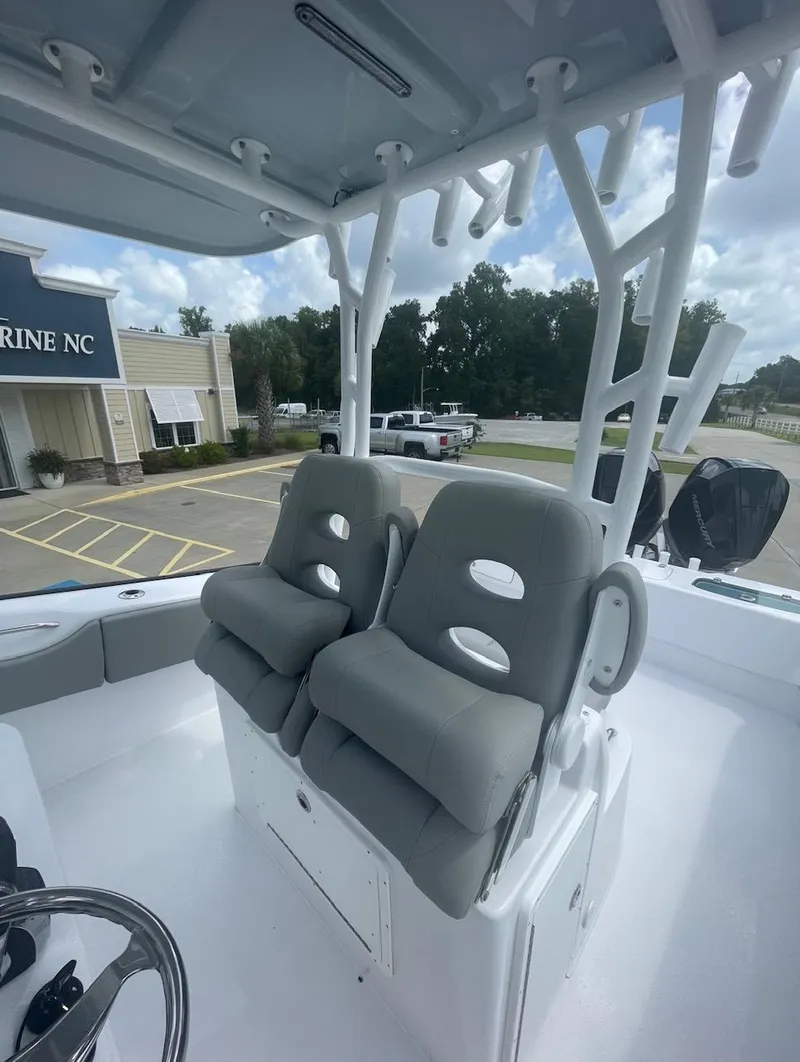 Slide: The Image of 2024 Cape Horn 31T boat with dual cushioned seats and rod holders. - 8