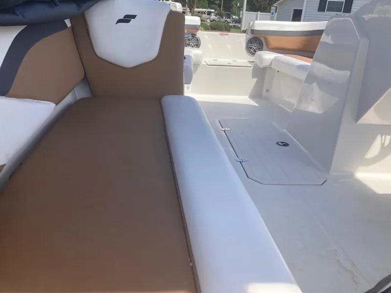 Slide: The Image of 2024 Starcraft SVX 191 boat interior with brown and white seating. - 6