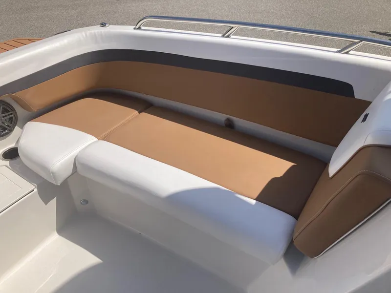 Slide: The Image of 2024 Starcraft SVX 191 boat interior seating with brown and white upholstery. - 8