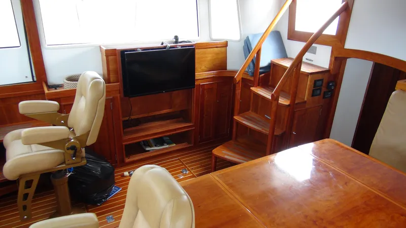 Slide: The Image of Luxurious interior of 2014 Shannon 55 HPS yacht with wooden finishes and seating. - 34