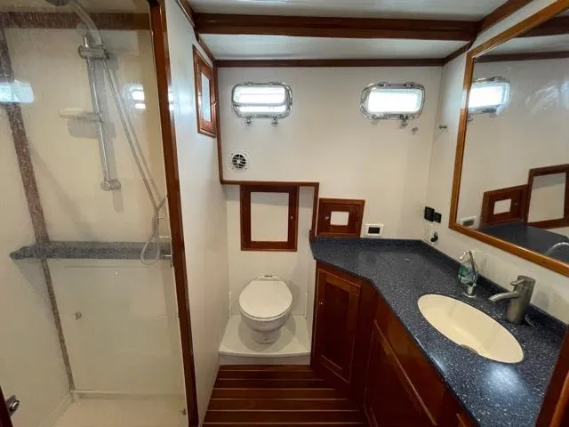 Slide: The Image of Luxurious bathroom in 2014 Shannon 55 HPS yacht with shower, toilet, and sink. - 38