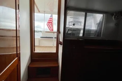 Slide: The Image of Interior view of 2014 Shannon 55 HPS yacht with American flag outside. - 44