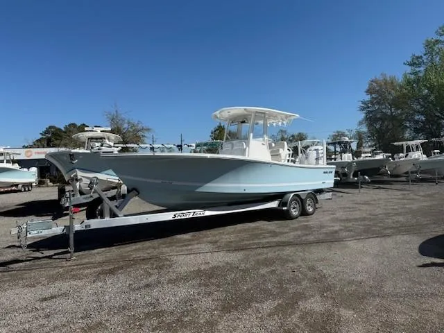 Slide: The Image of 2025 Regulator 26XO boat on trailer in outdoor lot. - 1