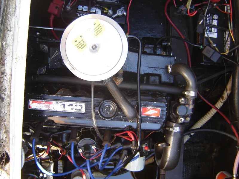 Slide: The Image of 1980 Century 26 engine compartment with wiring and components. - 38