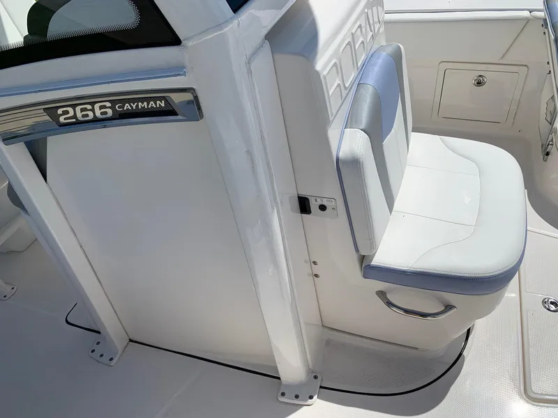 Slide: The Image of 2024 Robalo 266 Cayman boat interior seating and console. - 16