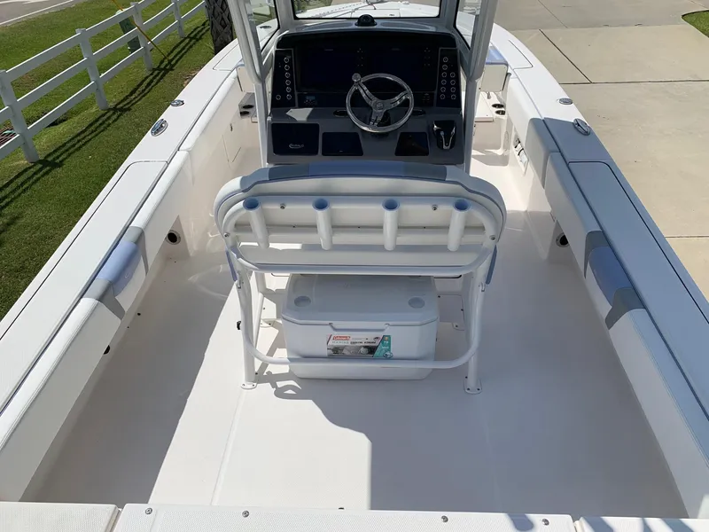 Slide: The Image of 2024 Robalo 266 Cayman boat interior with helm and seating. - 5