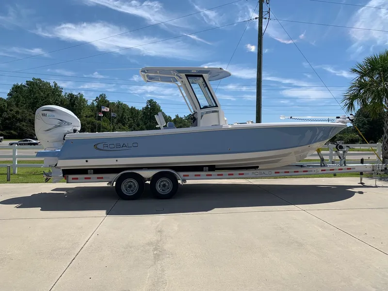 The Image of 2024 Robalo 266 Cayman boat on a trailer, side view. - 0