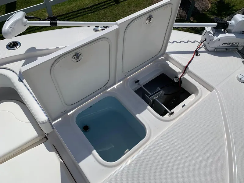 Slide: The Image of 2024 Robalo 266 Cayman boat storage compartments and livewell. - 20