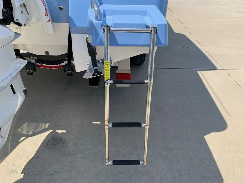 Slide: The Image of 2024 Robalo 266 Cayman boat with extended swim ladder. - 22