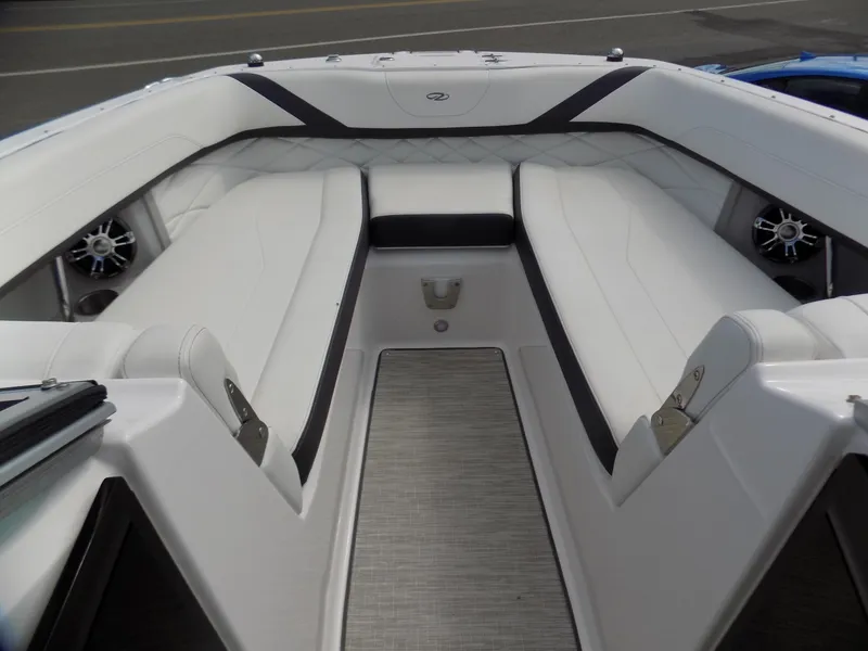 Slide: The Image of 2019 Regal 26 FasDeck boat interior with white seating and modern design. - 4