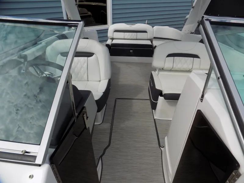 Slide: The Image of 2019 Regal 26 FasDeck boat interior with sleek seating and modern design. - 5