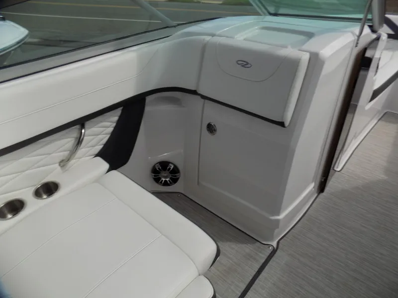 Slide: The Image of 2019 Regal 26 FasDeck interior with white seating and cup holders. - 8