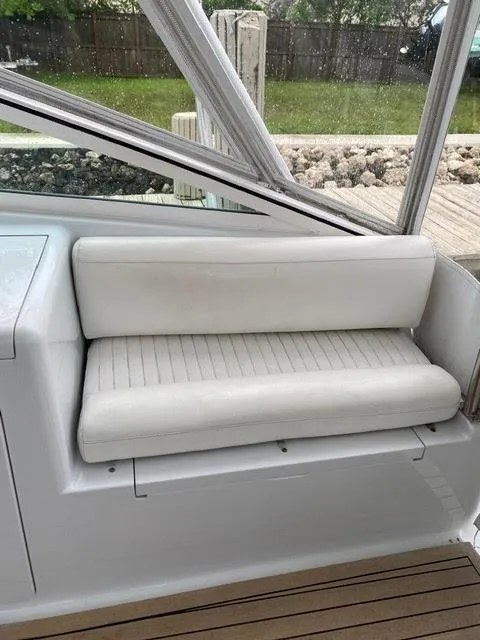 Slide: The Image of White cushioned seat on a 2003 Viking 50 Open boat. - 13