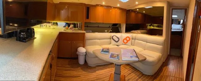 Slide: The Image of Interior of a 2003 Viking 50 Open yacht with modern kitchen and cozy seating area. - 35