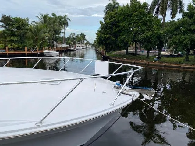 Slide: The Image of 2003 Viking 50 Open yacht docked in a tropical canal. - 4