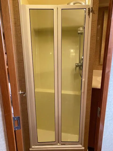 Slide: The Image of Compact shower stall in a 2003 Viking 50 Open yacht. - 41