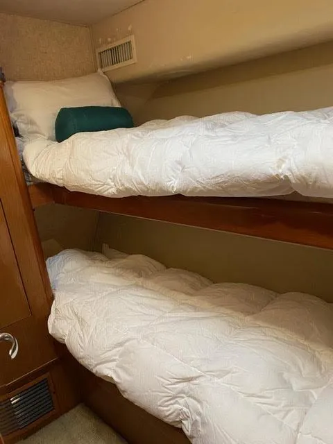 Slide: The Image of Bunk beds in the 2003 Viking 50 Open yacht cabin. - 43