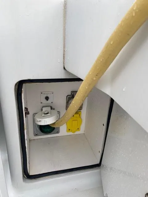 Slide: The Image of Electrical outlet compartment on a 2003 Viking 50 Open boat. - 46